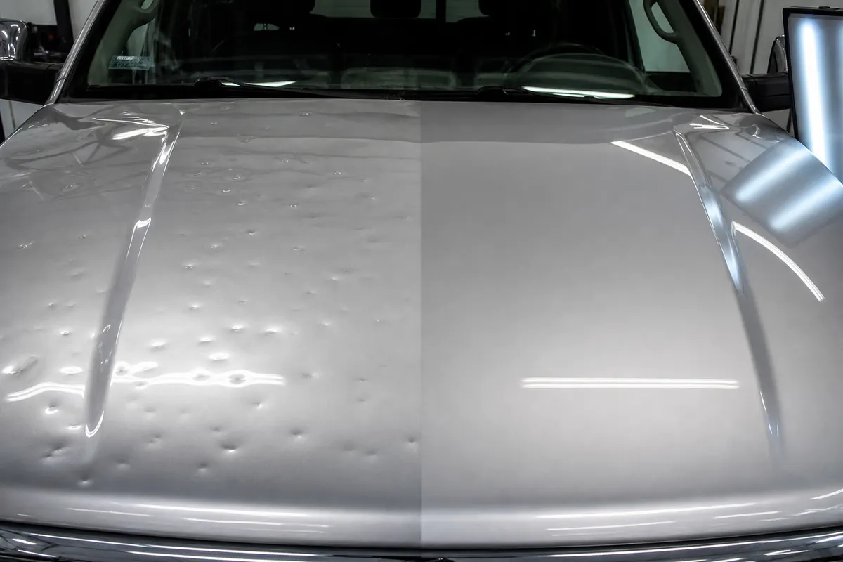 Hail-damaged vehicle hood before paintless dent repair and smooth hood after repair